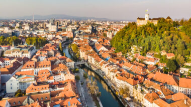Aerial panoramic view of Ljubljana, capital of Slovenia in warm afternoon sun.