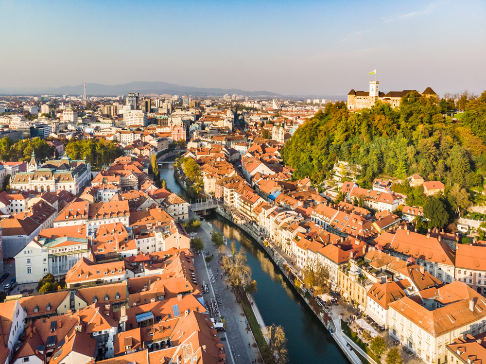 Aerial panoramic view of Ljubljana, capital of Slovenia in warm afternoon sun.